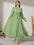 Modely Mock Neck Lantern Sleeve Belted Pleated Hem Dress