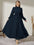 Modely Mock Neck Lantern Sleeve Belted Pleated Hem Dress